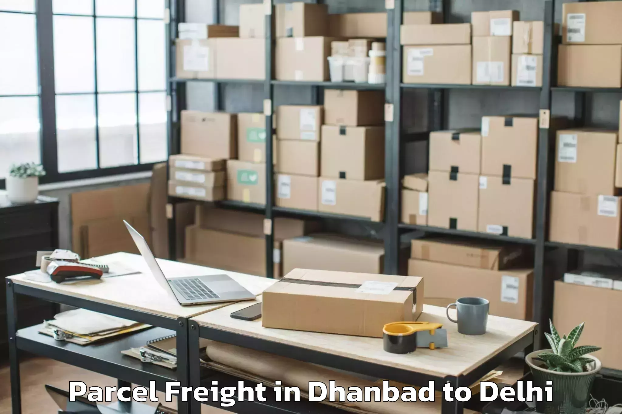 Get Dhanbad to Unity One Mall Rohini Parcel Freight